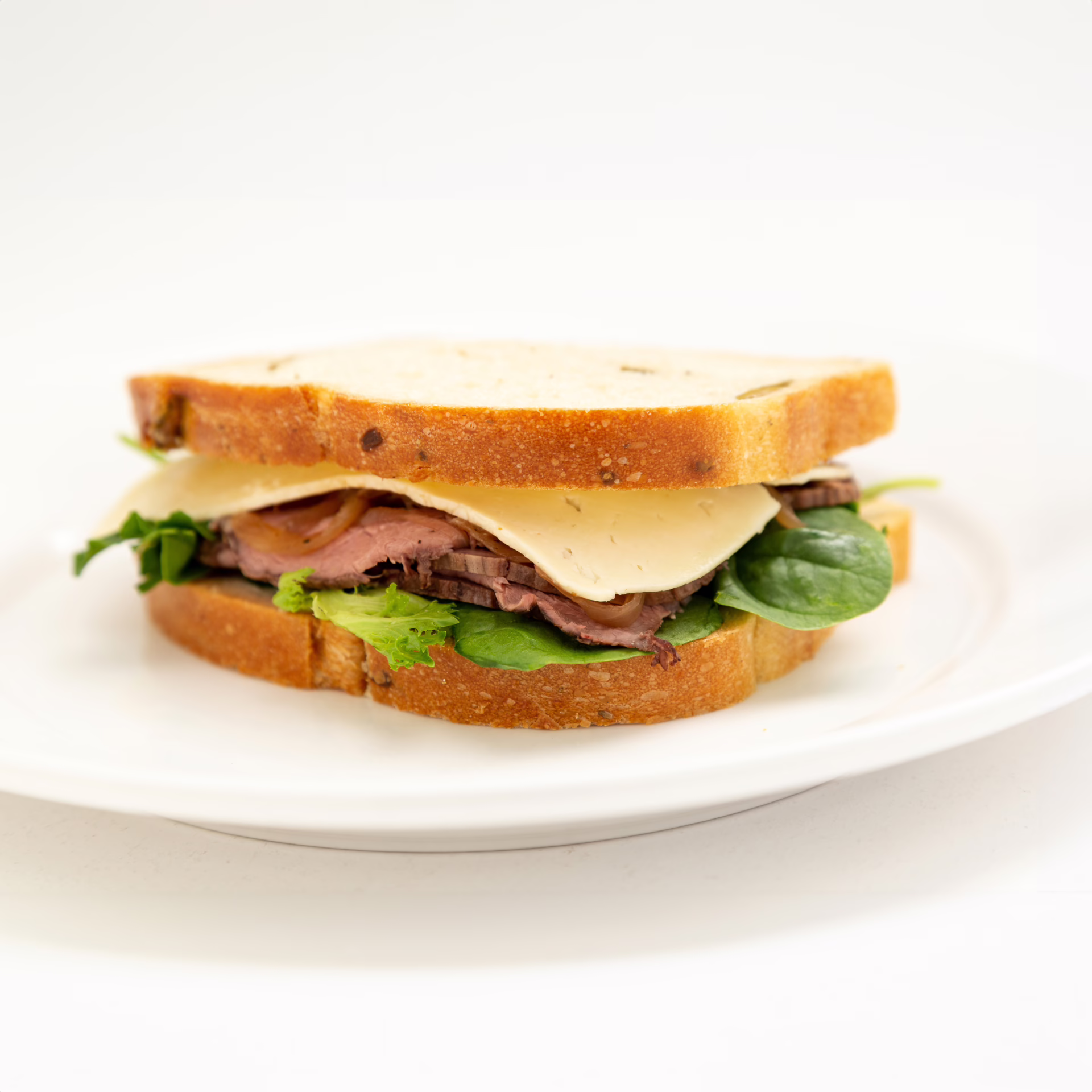 Walnut loaf, horseradish mayonnaise, roast beef, Havarti cheese, caramelized onion, and mixed spring green.