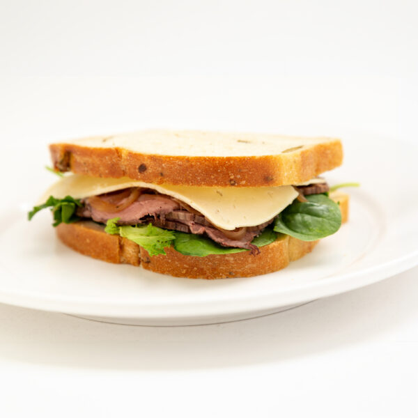 Walnut loaf, horseradish mayonnaise, roast beef, Havarti cheese, caramelized onion, and mixed spring green.