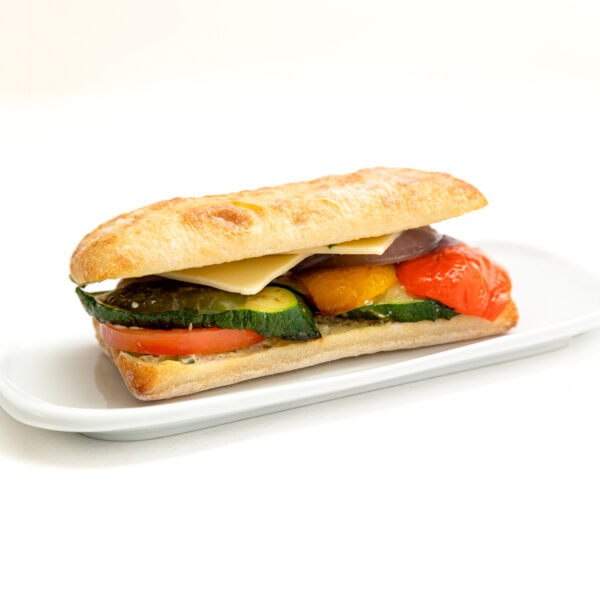 ROASTED VEGETABLE with Ciabatta bread, Roasted Peppers, Zucchini, and onions, tomato, Swiss Cheese + Pesto mayonnaise.