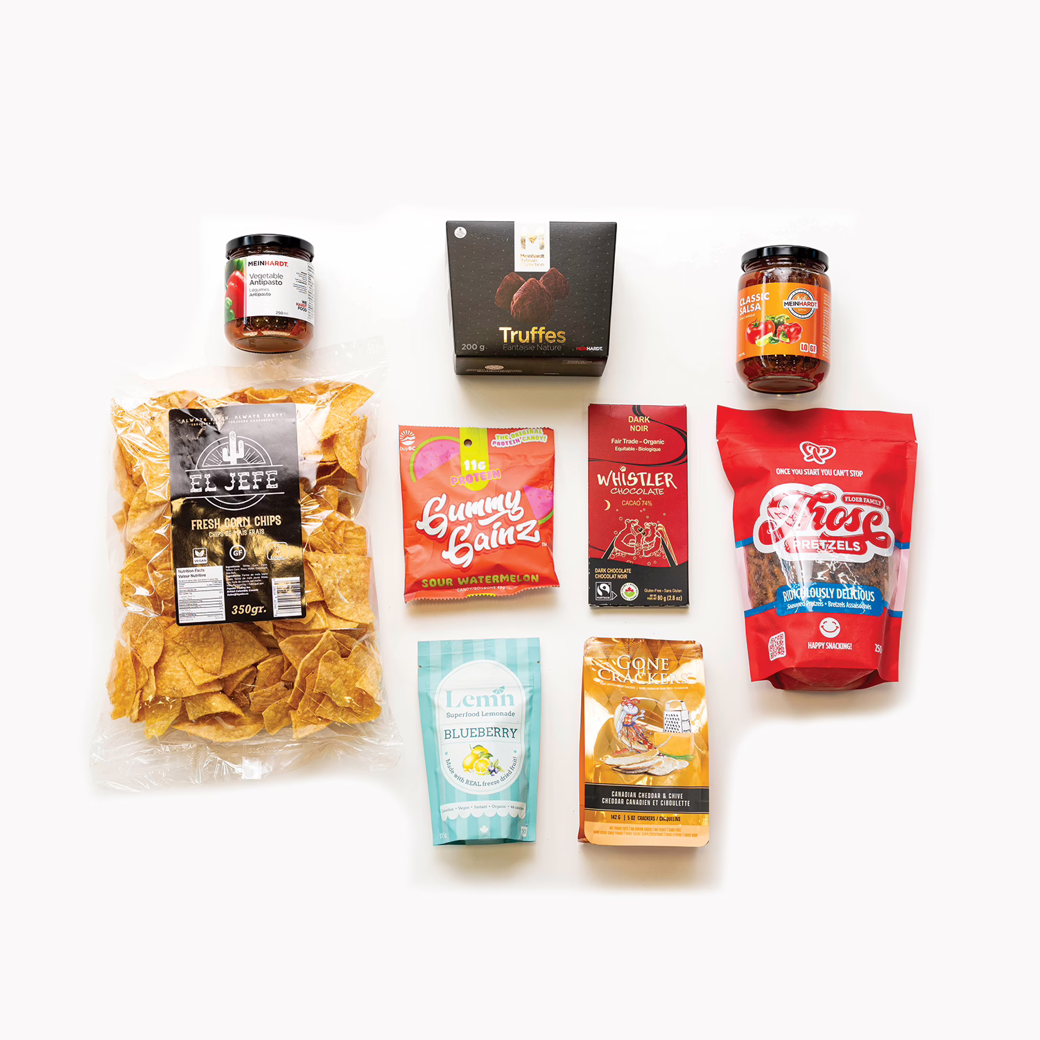 Best of Local gourmet gift basket items spread with Vancouver artisan foods and BC-made treats.